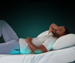 Man lying on mattress with pressure support emphasized