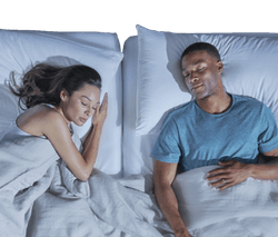 Couple sleeping on Tempur Pedic mattress