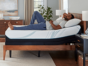 A side profile of a man resting in his Tempur-Pedic adjustable bed.